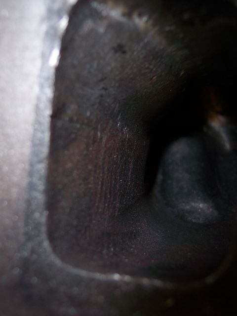 1967 Ford Mustang - Internal view of an engine part, showing machined surfaces and signs of use.