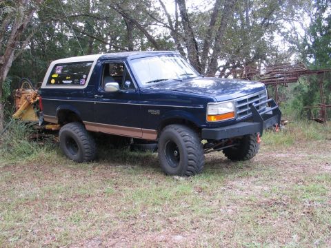 1995 Ford Bronco - This 1995 Ford Bronco features a custom front bumper and appears to be lifted.