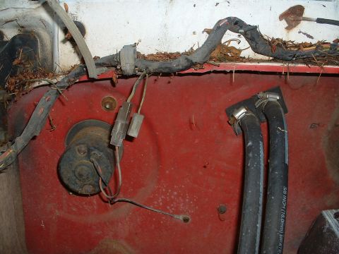 1978 Ford Bronco - This image shows a section of a vehicle's engine bay with various wires and hoses visible.