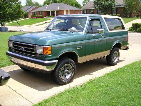 1989 Ford Bronco - This two-tone green and tan 1989 Ford Bronco is shown from a three-quarter front view.