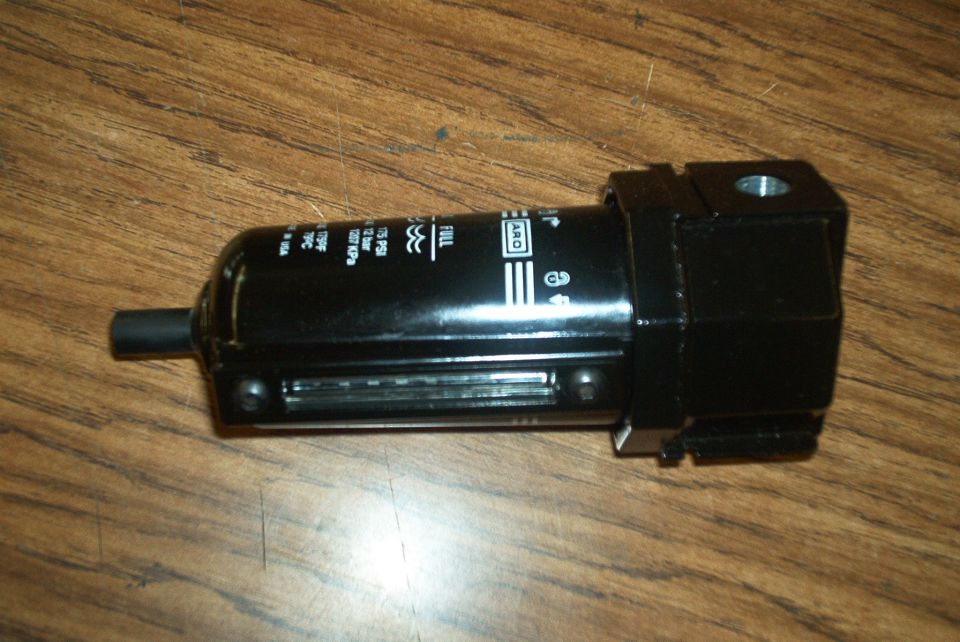 Black air filter regulator with pressure markings and ARO logo