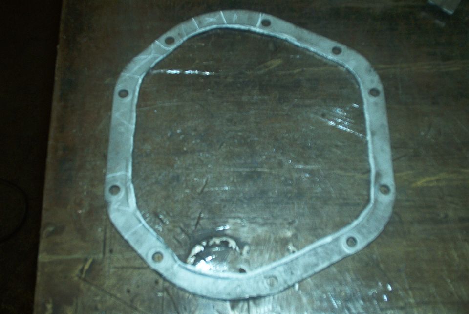 Differential cover gasket on a wooden surface