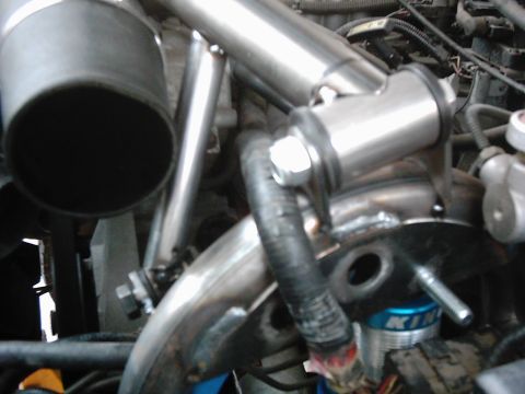 1978 Ford Bronco - Custom exhaust and suspension components are visible in this engine bay detail shot.