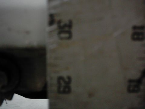 1978 Ford Bronco - A ruler with markings up to 30 is shown next to a vehicle part, indicating a measurement is being taken.