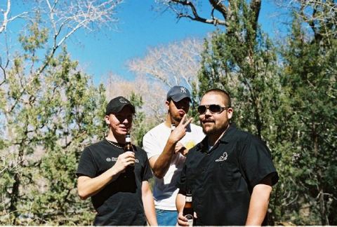 1993 Ford Probe - Three men pose for a photo outdoors, holding beer bottles and enjoying a sunny day.