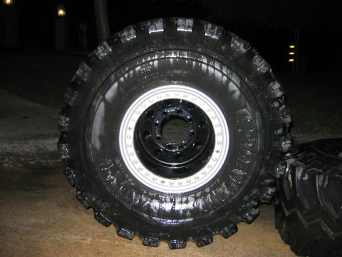 1985 Ford Bronco - A large off-road tire and wheel assembly is shown, likely for a custom build or heavy-duty application.