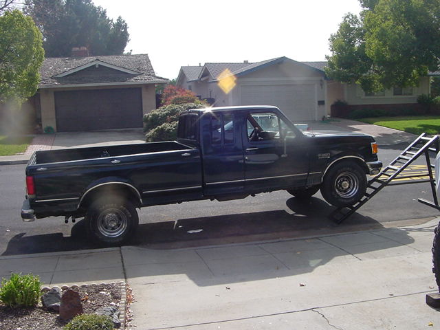 Black Ford F-Series pickup truck on a ramp