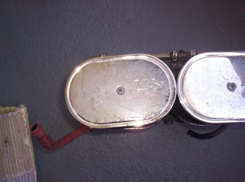 1987 Suzuki Samurai - Close-up of a K&N air filter assembly, showing chrome covers and a red hose attachment.