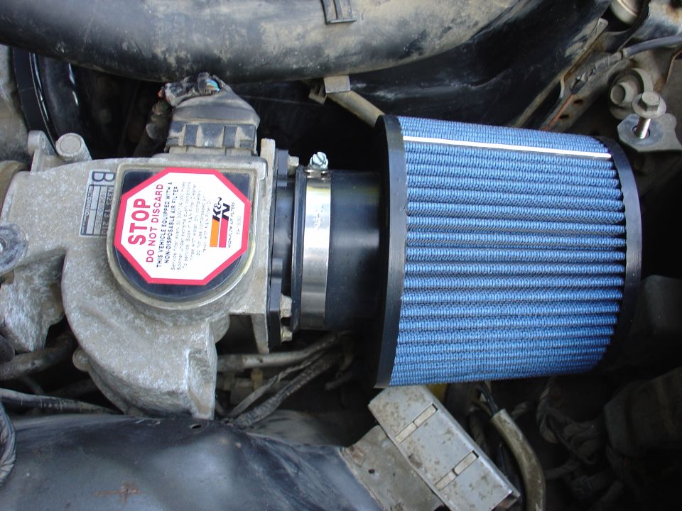 Engine air intake with K&N filter and STOP warning label