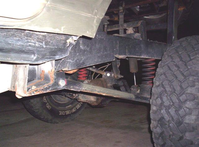 Close-up of the rear suspension and tire of an off-road vehicle