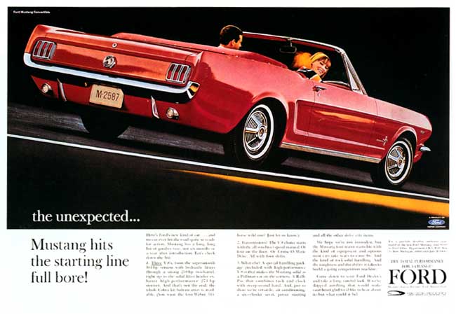 Red convertible Ford Mustang with license plate M-2587, seen from rear three-quarter angle