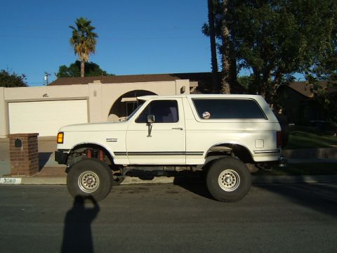 1988 Ford Bronco - This lifted white Ford Bronco appears to be from the late 1980s, not a 1988 model.