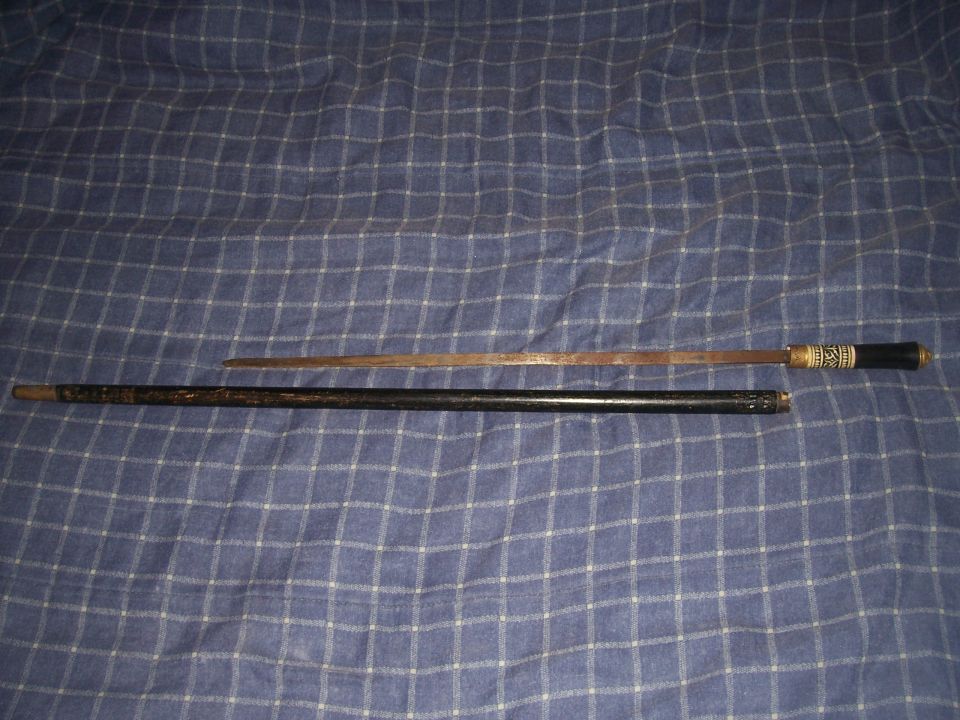 Cane sword with ornate handle