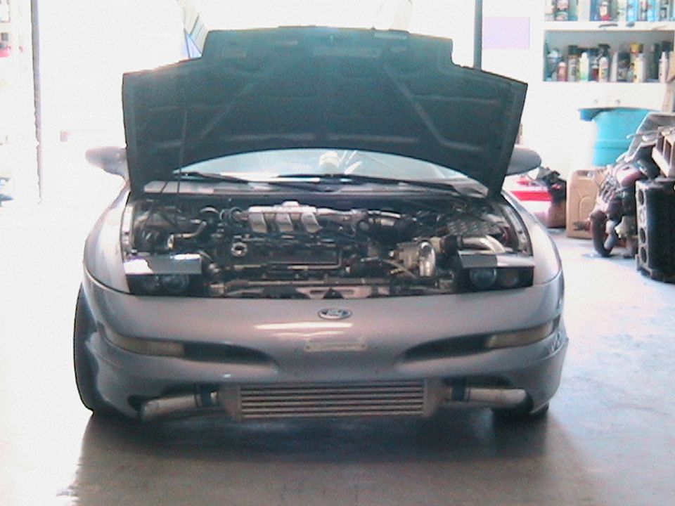 1995 Ford Probe front with hood open showing engine and intercooler