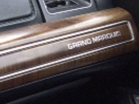 1991 Ford Crown Victoria LTD - Close-up of interior trim with "GRAND MARQUIS" badging.