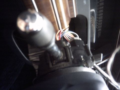 1991 Ford Crown Victoria LTD - Close-up of the interior of a 1991 Ford Crown Victoria LTD, highlighting the gear shifter and dashboard instrumentation.