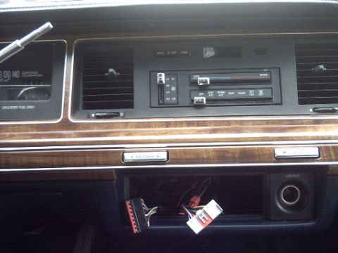 1991 Ford Crown Victoria LTD - Interior view of a 1991 Ford Crown Victoria LTD dashboard, highlighting the center console and exposed wiring.