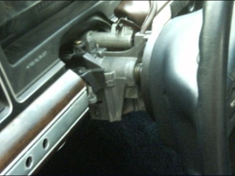 1991 Ford Crown Victoria LTD - The interior of a 1991 Ford Crown Victoria LTD shows the steering column and wood-grain trim on the dashboard.