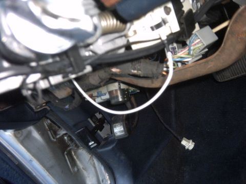 1991 Ford Crown Victoria LTD - Close-up of the interior wiring harness and pedals, including the hood release lever.