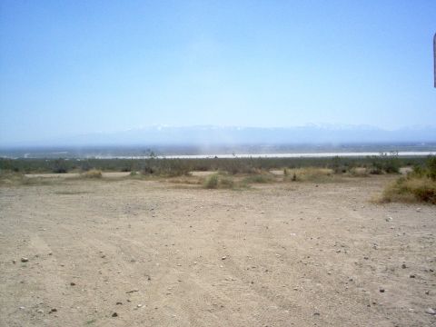 2004 Ford F-150 - Desert scene with mountains in the background and a Supermotors.net logo visible.