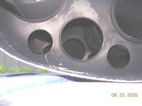 2004 Ford F-250 - Close-up of an exhaust pipe, showing internal structure and a date stamp.