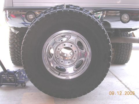 2004 Ford F-250 - Spare tire is mounted in front of the rear bumper of a 2004 Ford F-250.