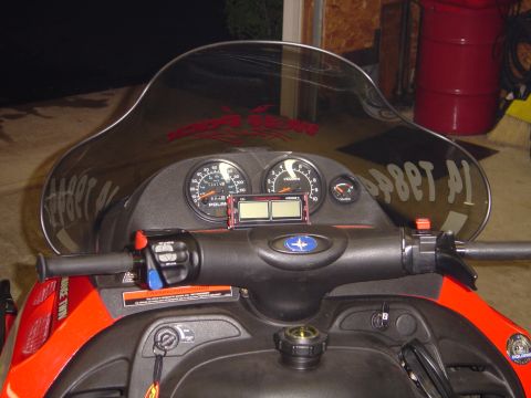 1978 Ford Bronco - Close-up of a snowmobile's instrument panel, multiple gauges and controls.