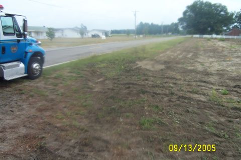 1998 Ford Crown Victoria - A fire truck is parked on the side of a road next to a grassy embankment. The date 09/13/2005 is visible.