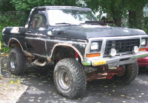 1978 Ford Bronco - This modified 1978 Ford Bronco features a lifted suspension and an aftermarket hood scoop, giving it a off-road appearance.