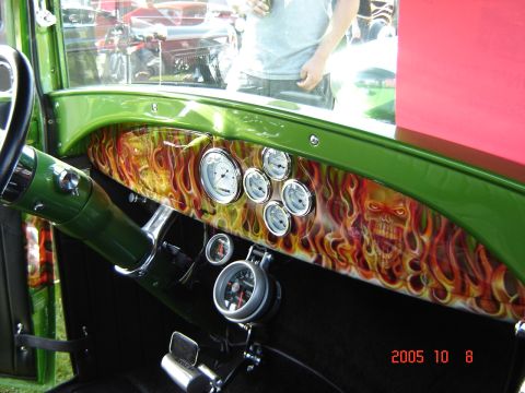 1993 Ford Bronco - Interior view of a custom dashboard flame and skull graphics with various gauges.