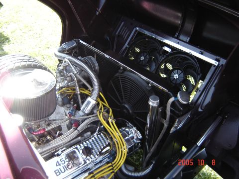 1993 Ford Bronco - Close-up of a custom engine bay a Buick 455 engine and dual cooling fans.