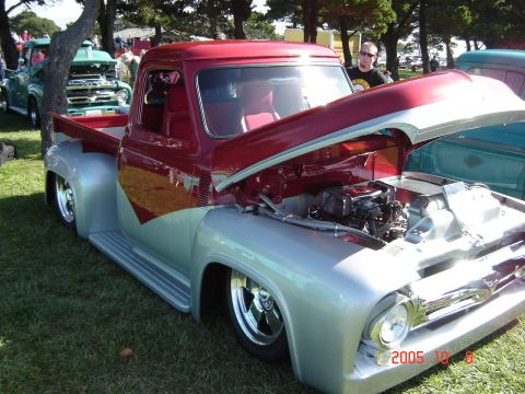 1993 Ford Bronco - Customized 1956 Ford F-series pickup truck with hood open, parked on grass at an outdoor event.