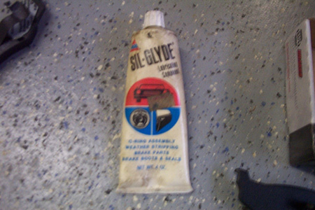 1999 Chrysler 300M - Sil-Glyde lubricating compound is used for various automotive parts including brake components.