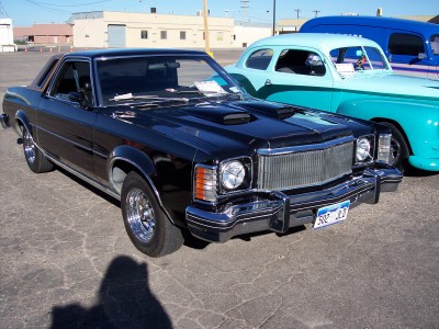 1972 Ford Ranchero - A black 1977 Ford Ranchero is parked next to other vintage vehicles.