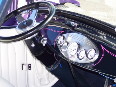 1972 Ford Ranchero - Custom interior dashboard features multiple gauges and purple pinstriping on a black dash.