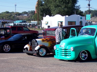 1972 Ford Ranchero - A collection of vintage and custom vehicles are parked together on a sunny day.