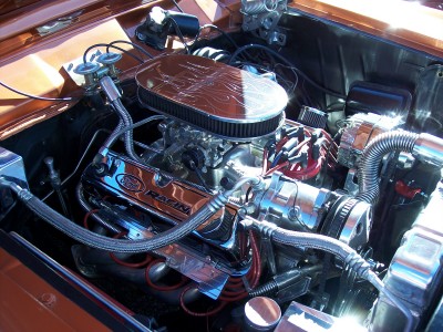 1972 Ford Ranchero - Detailed view of a chrome-accented engine bay, Ford Racing valve covers, likely from a 1972 Ford Ranchero.