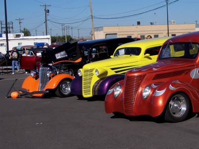 1972 Ford Ranchero - Custom hot rods displayed at an event, unique paint jobs and modifications.