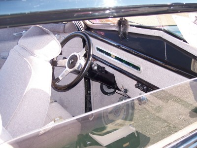 1972 Ford Ranchero - Interior view of a car's dashboard and seating area, showing details of the steering wheel and console.