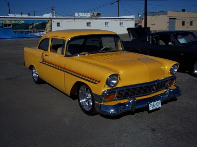 1972 Ford Ranchero - Yellow 1956 Chevrolet Bel Air parked outdoors, with another vehicle visible behind it.