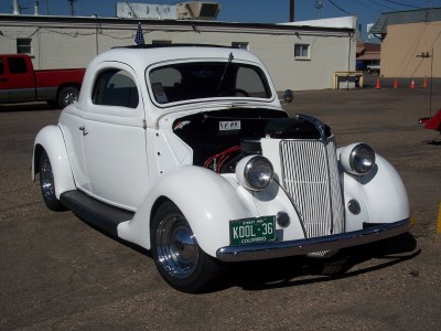 1972 Ford Ranchero - A white 1936 coupe is parked with its hood open, displaying a Colorado license plate that reads KOOL-36.
