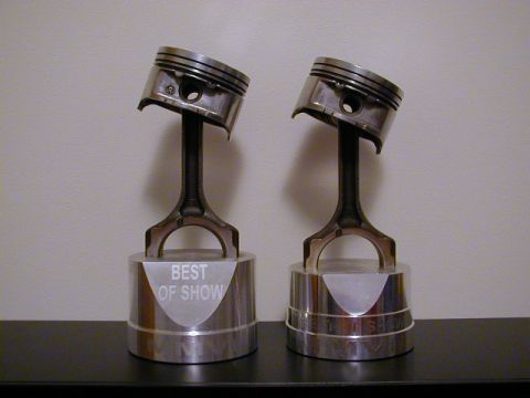 1994 Ford Probe - Piston trophies, one labeled 'BEST OF SHOW', suggest automotive awards.