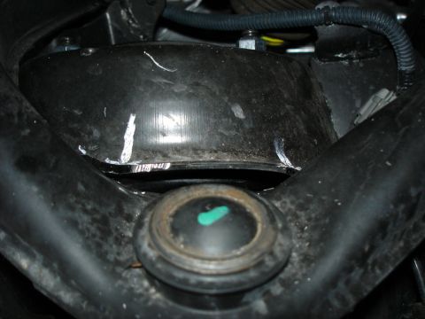 2005 Nissan Titan - This image shows a close-up of vehicle suspension parts, not a specific model year.