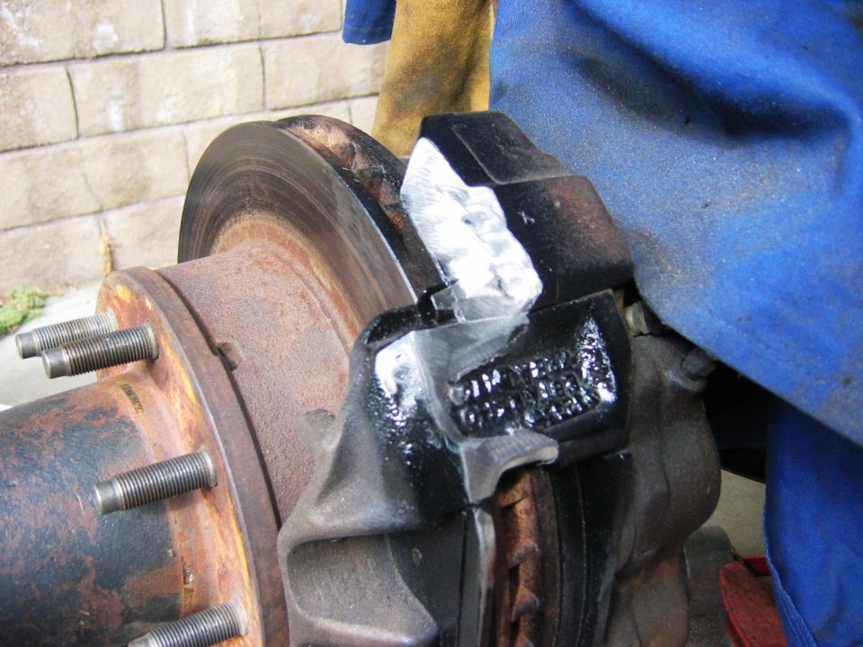 grinded the caliper and bracket down