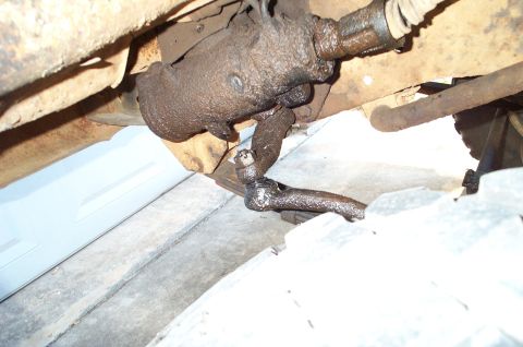 1978 Dodge Power Ram - Close-up view of the steering linkage and a tire, showing mechanical components.