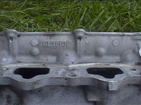1994 Ford Probe - Cast metal engine component with visible stamping and mounting holes.