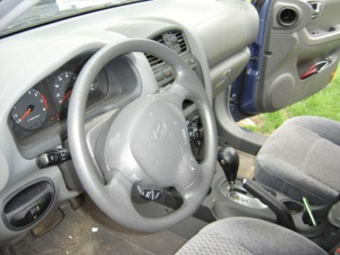 1999 Ford Taurus - Interior view of a Hyundai vehicle, showing the steering wheel, instrument cluster, and gear shifter.