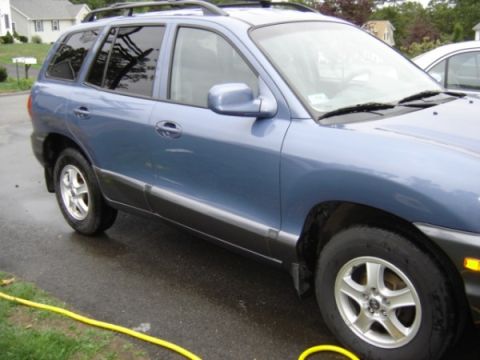 1999 Ford Taurus - This blue SUV, likely from around 2001, is shown from the side.