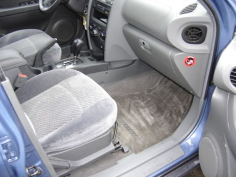 1999 Ford Taurus - Interior view of a car's passenger side, showing the seat and dashboard area.
