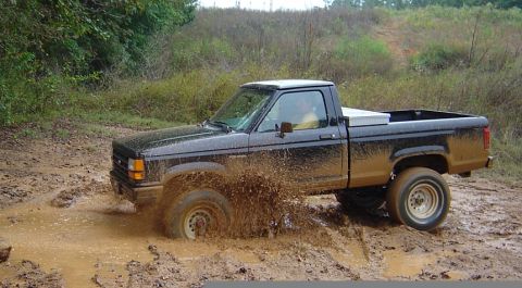 1989 Ford Ranger - This 1989 Ford Ranger is navigating a challenging muddy terrain.